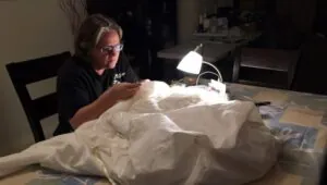 Bullhead City seamstress stitching in her workroom